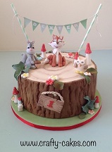 Woodland theme birthday cake log effect with animals